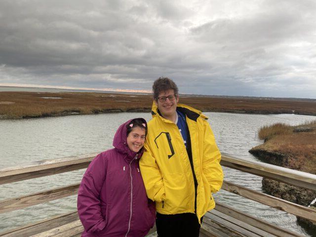 Two Students watch sunset during the Cape Cod Winter